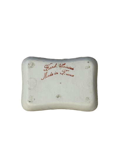 Underside of the French trinket dish with red script mark reading Hand Painted, Made in France