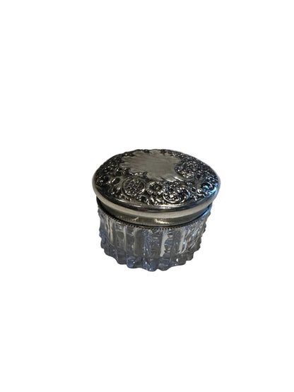 Vintage crystal and sterling petite dresser jar, closed view of the ornate floral repoussé silver lid.