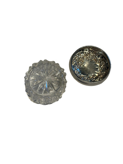 Vintage crystal and sterling petite dresser jar, open body beside the floral repoussé lid, interior up.