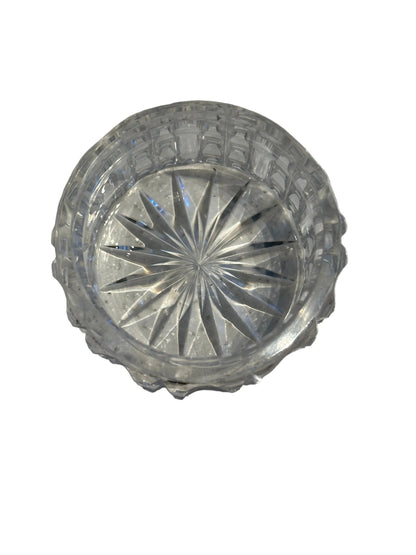 Vintage crystal and sterling petite dresser jar, top-down into the open jar with starburst-cut base.