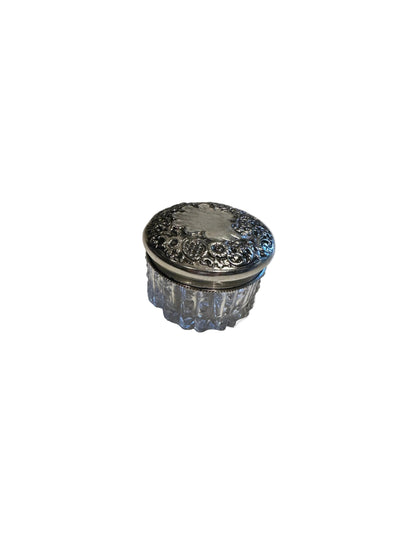 Vintage crystal and sterling petite dresser jar, raised angle showing the floral repoussé silver lid.