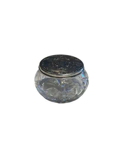 Gorham vintage crystal and silver dresser jar, low angle showing the hallmarked silver collar and lid.