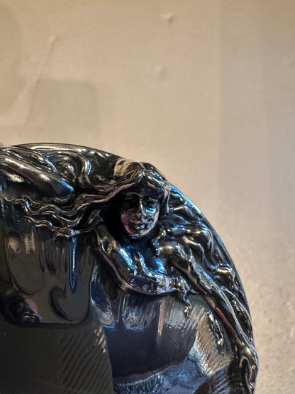 Close-up of sterling silver lid detail showing Art Nouveau female figure with flowing hair