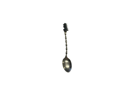 Sterling silver pagoda demitasse spoon, vertical view with dark patinated pagoda finial and twisted handle.