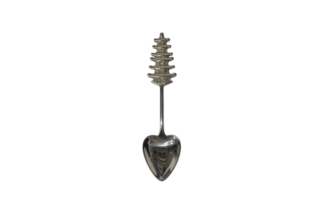 Sterling silver souvenir spoon with detailed five-tier pagoda handle and heart-shaped bowl