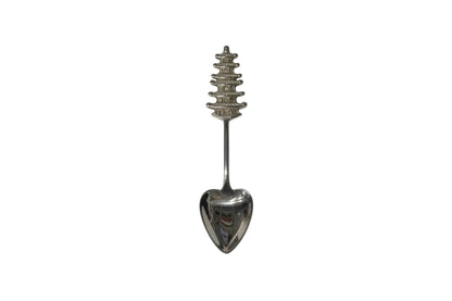 Sterling silver souvenir spoon with detailed five-tier pagoda handle and heart-shaped bowl
