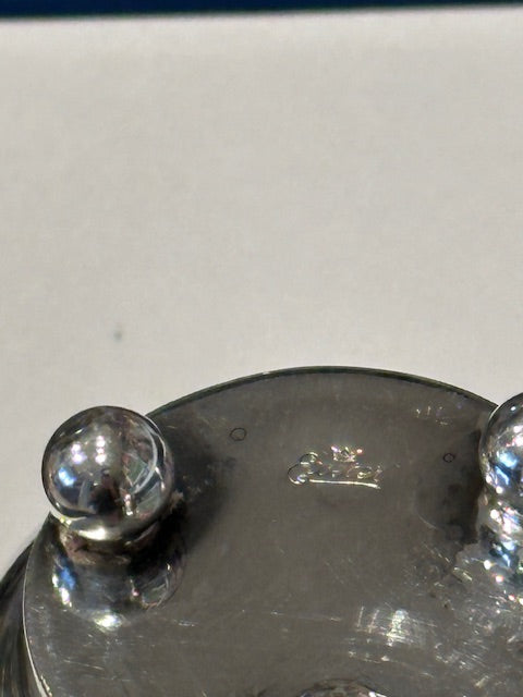 Close-up of toothpick holder base with ball foot and faint crown and Exeter hallmark
