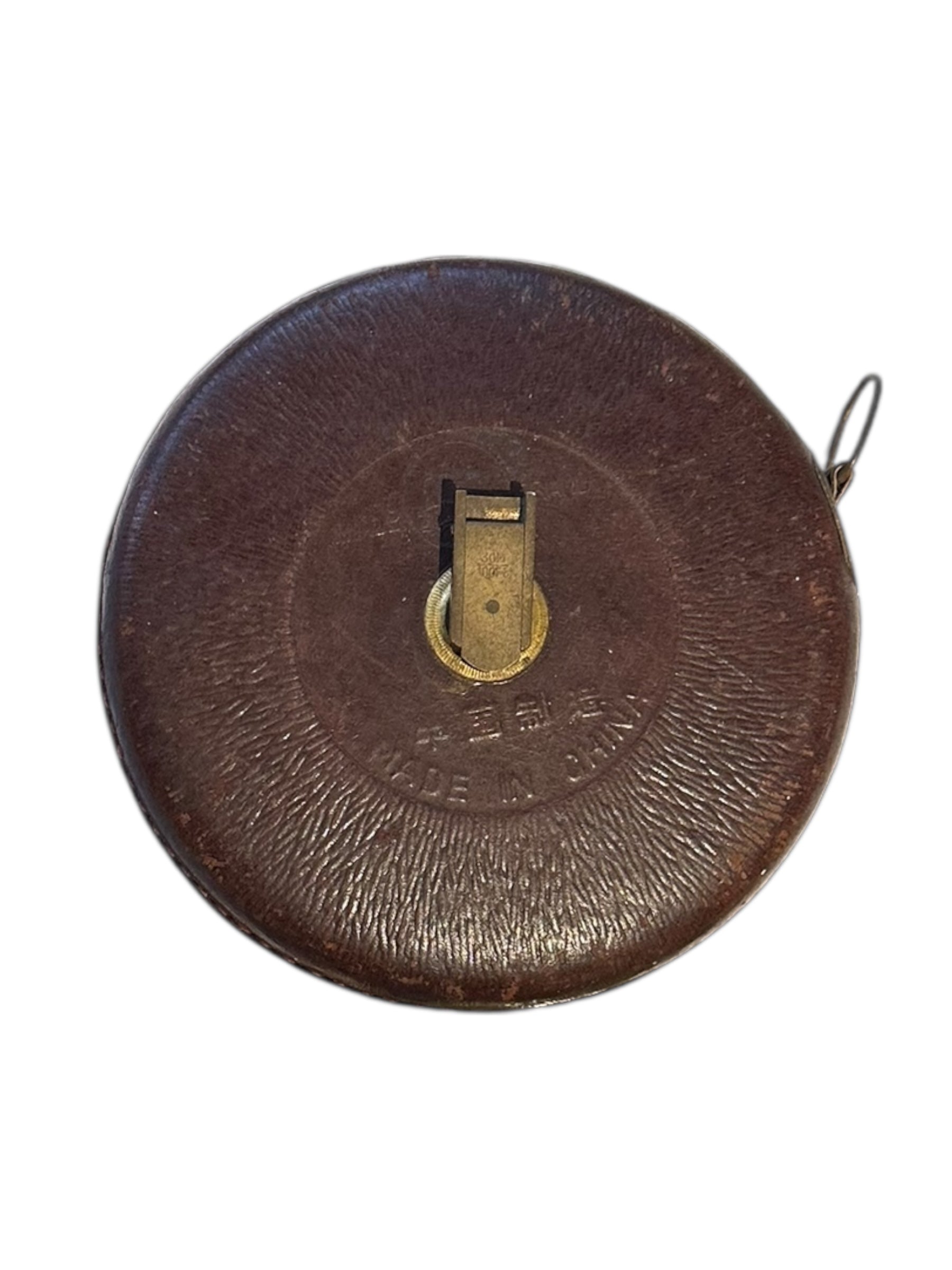 Back of the antique leather tape measure case, embossed 'Made in China' and brass winder