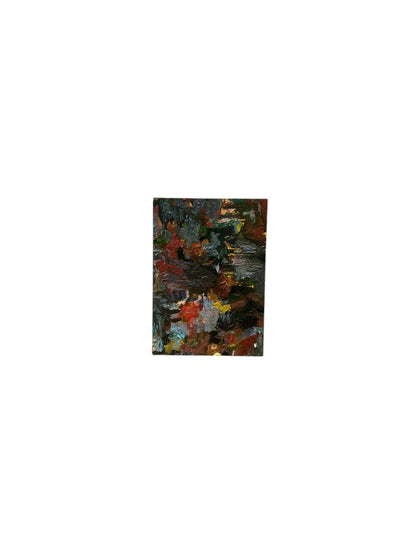 Oil on board abstract by J. Dunn in deep blue-black with red highlights, viewed at an angle showing the edge.