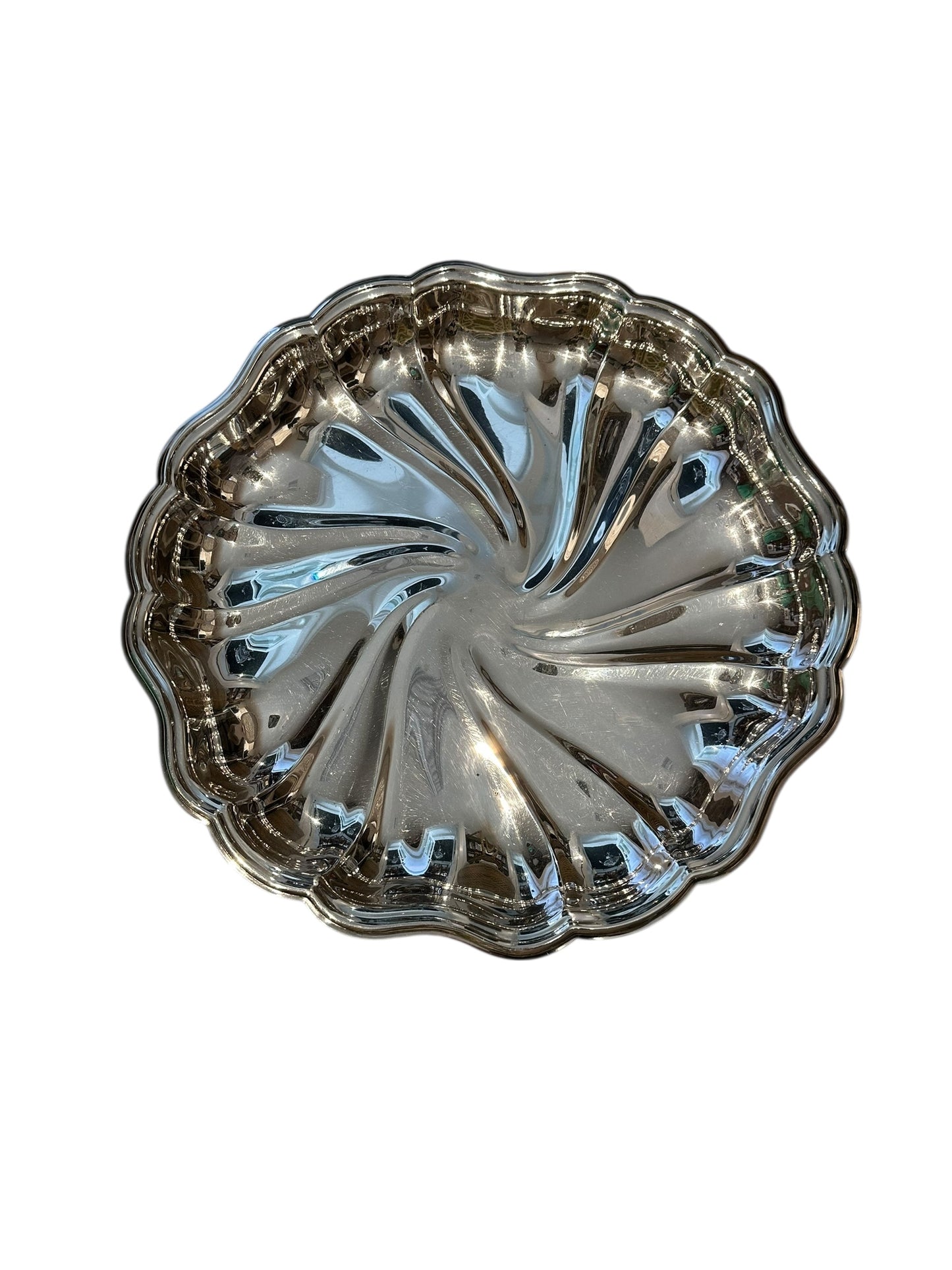 Vintage fluted silverplate serving dish with swirled center and wavy scalloped edge, top view