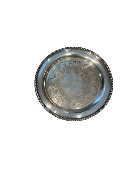 Vintage 11-inch silverplate serving tray with engraved scrollwork center and gadrooned rope rim