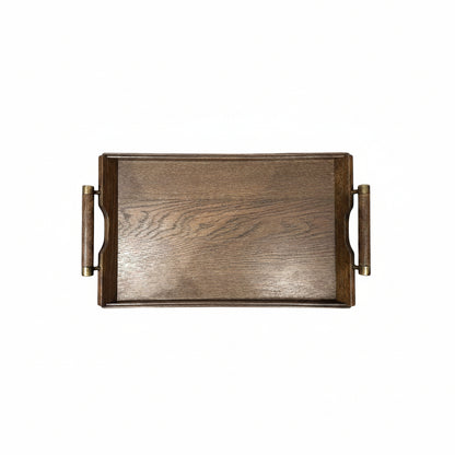 Small mid-century wooden serving tray with brass-trimmed handles, top view