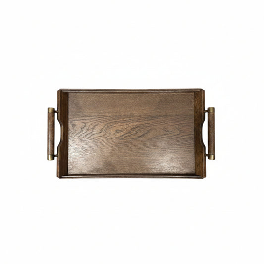 Small mid-century wooden serving tray with brass-trimmed handles, top view