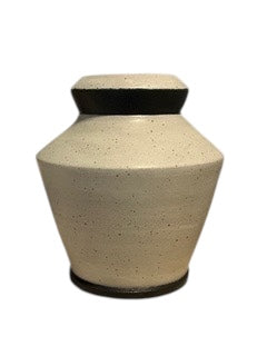 Studio-made white stoneware medium vessel, front view with flat dark lid-like rim.