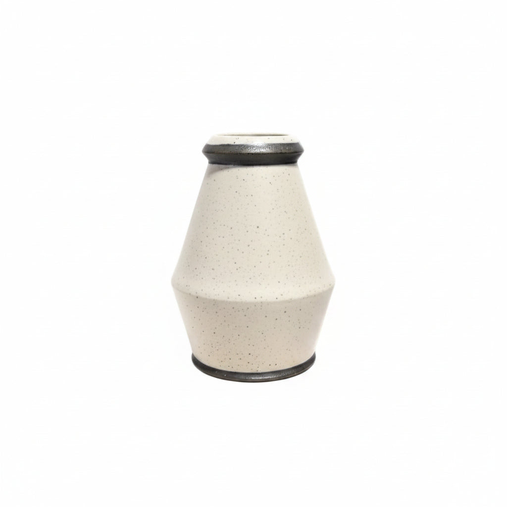 Studio-made white stoneware tall vessel, speckled body with dark glazed rim and base, front view.