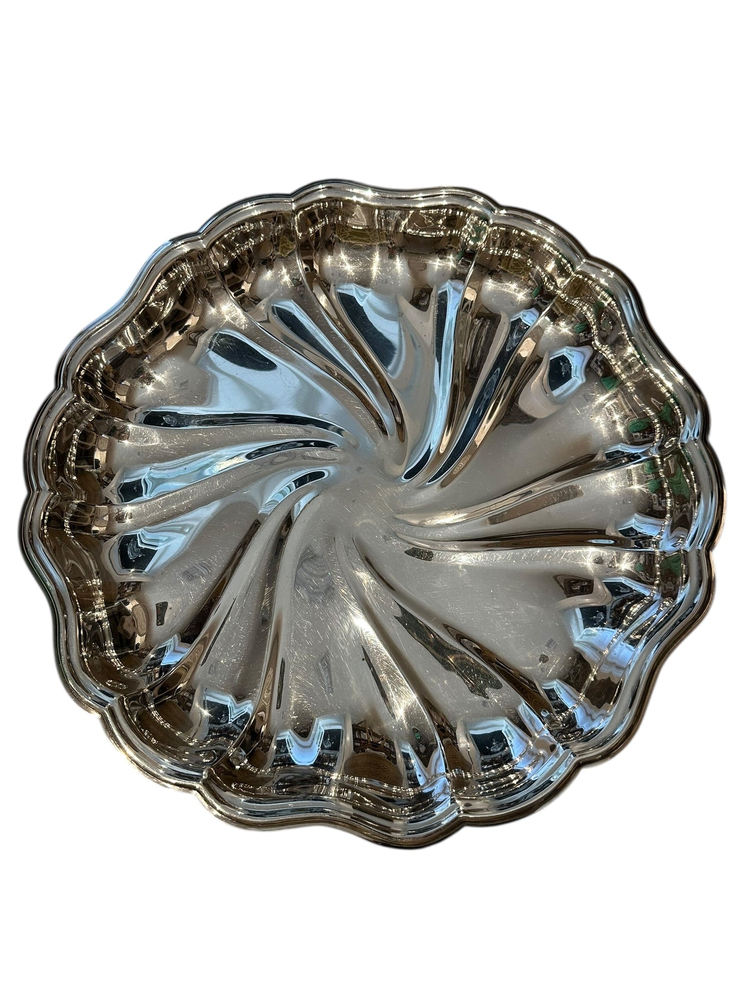 Vintage fluted silverplate serving dish, angled top view of swirled pinwheel fluting