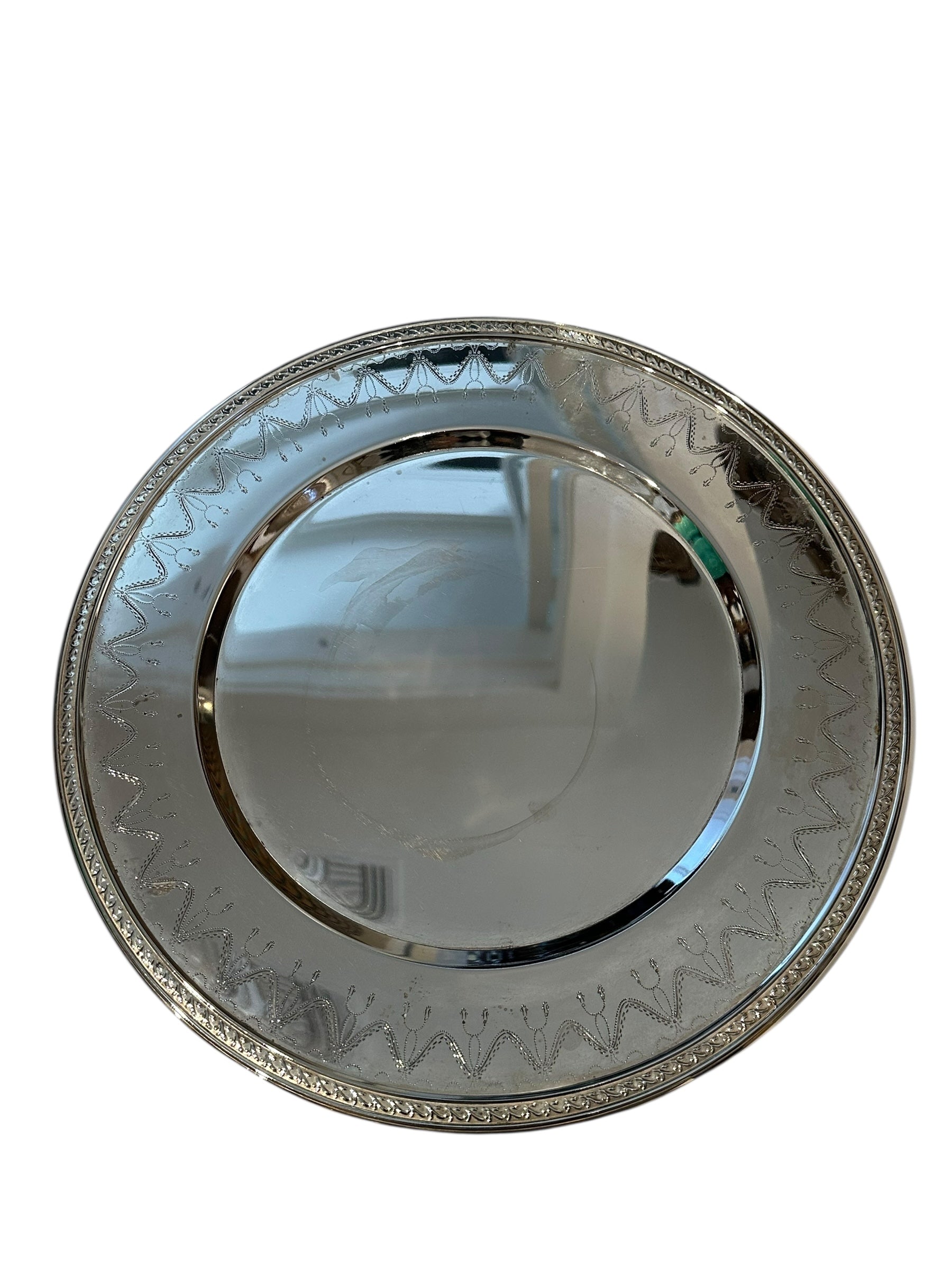 Vintage small round silverplate serving tray with engraved swag border and beaded rim, top view