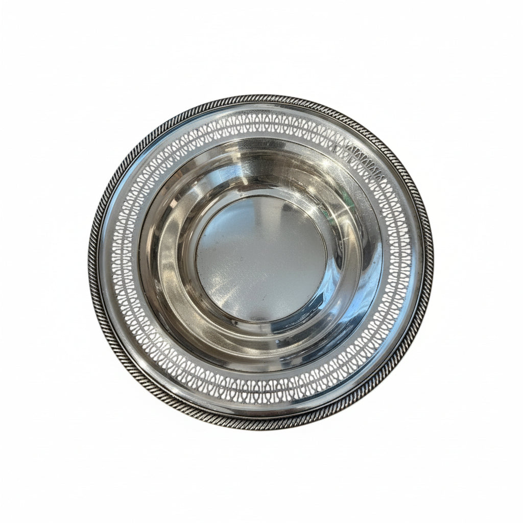 Vintage pierced silverplate decorative bowl with reticulated rim, gadrooned edge and deep well, top view