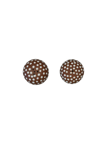 Top view of the pair of brown mushroom salt and pepper shakers with white-dotted caps