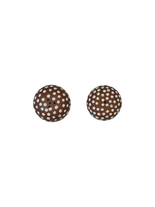 Top view of the pair of brown mushroom salt and pepper shakers with white-dotted caps