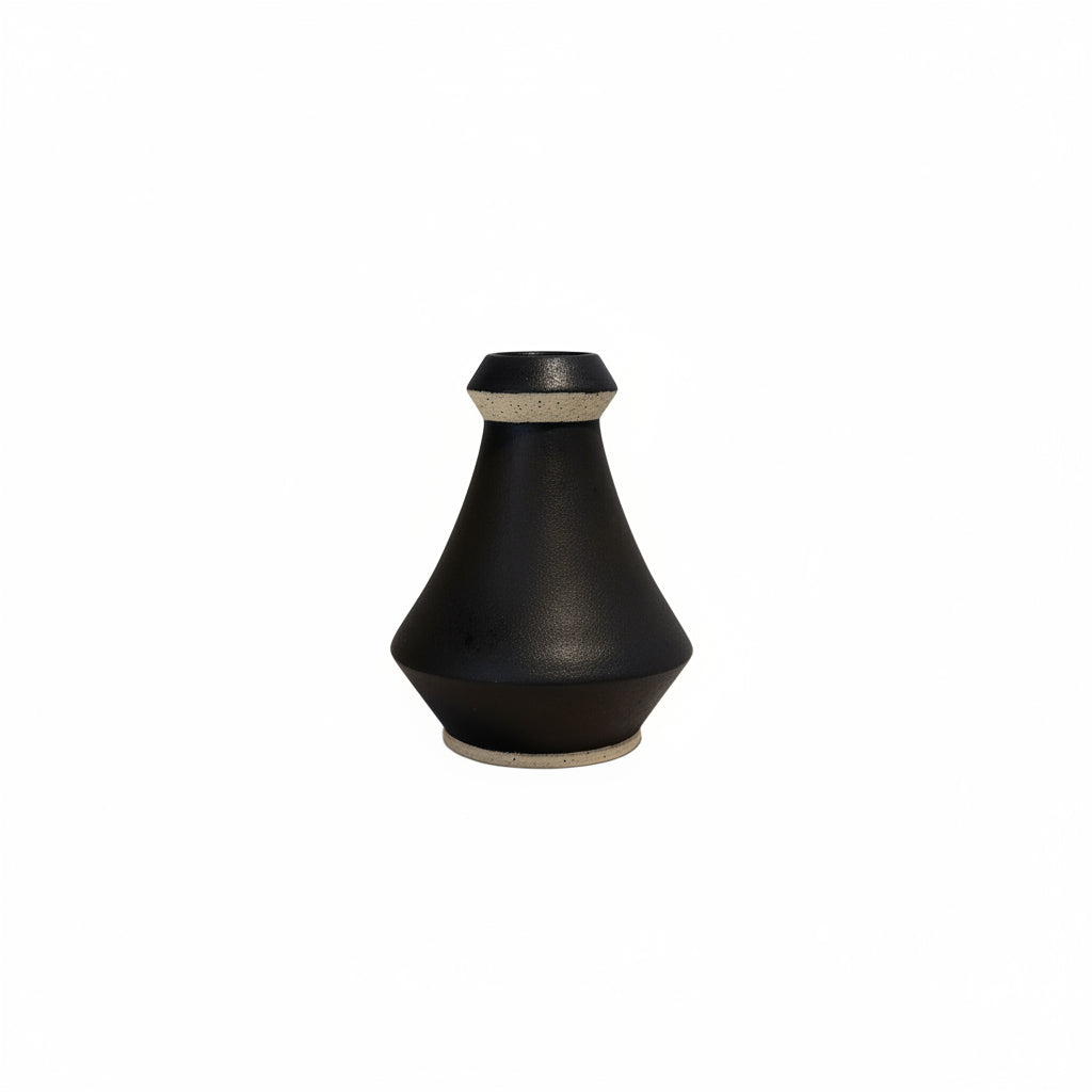 Studio-made black stoneware vase, matte tapered form with unglazed sandy collar and foot.