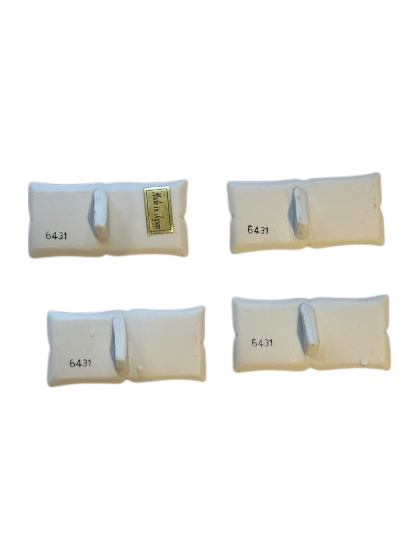 Underside view of porcelain place card holders with 6431 numbering and Made in Japan sticker