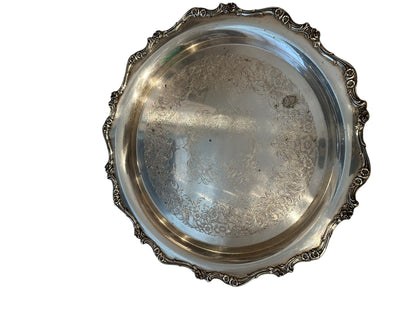 Vintage round silverplate serving tray, engraved floral scrollwork center with scalloped scroll rim