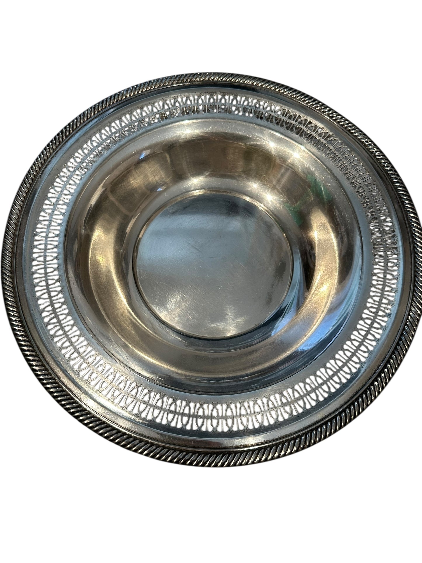 Vintage pierced silverplate decorative bowl, angled view of reticulated rim and gadrooned edge