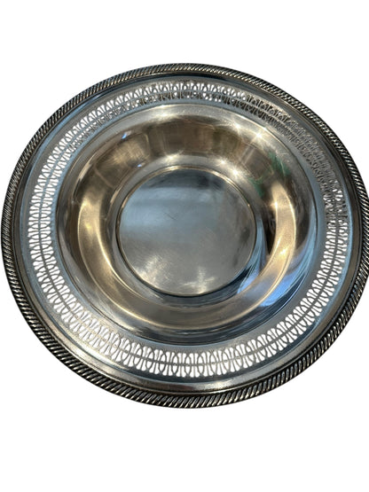 Vintage pierced silverplate decorative bowl, angled view of reticulated rim and gadrooned edge