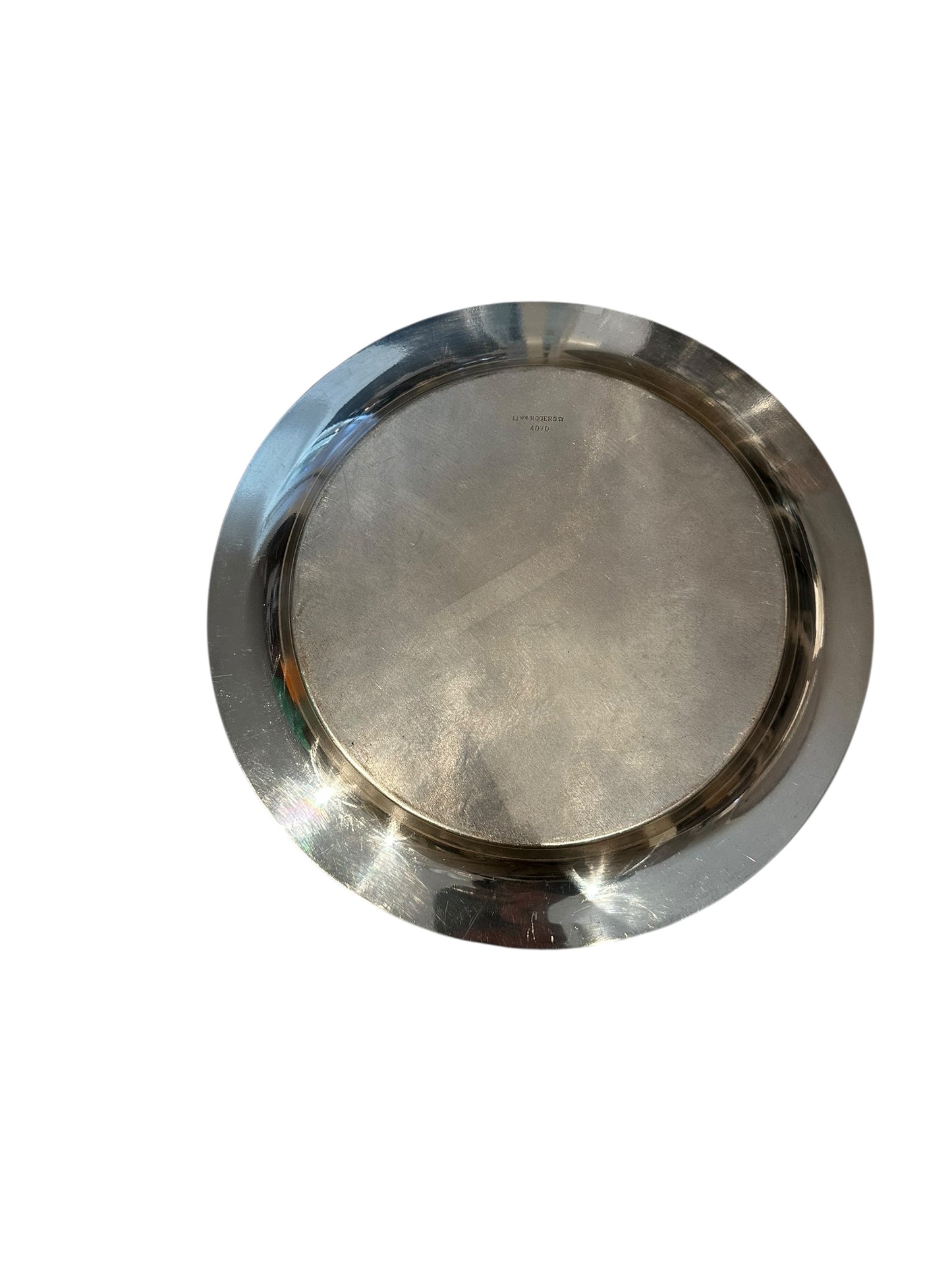Underside of vintage 11-inch silverplate serving tray showing center maker's stamp