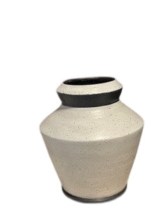 Studio-made white stoneware medium vessel, side view with dark rim and speckled body.