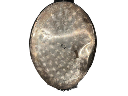 Underside of the silver-plated swan jardiniere showing hammered metal base and maker's stamp