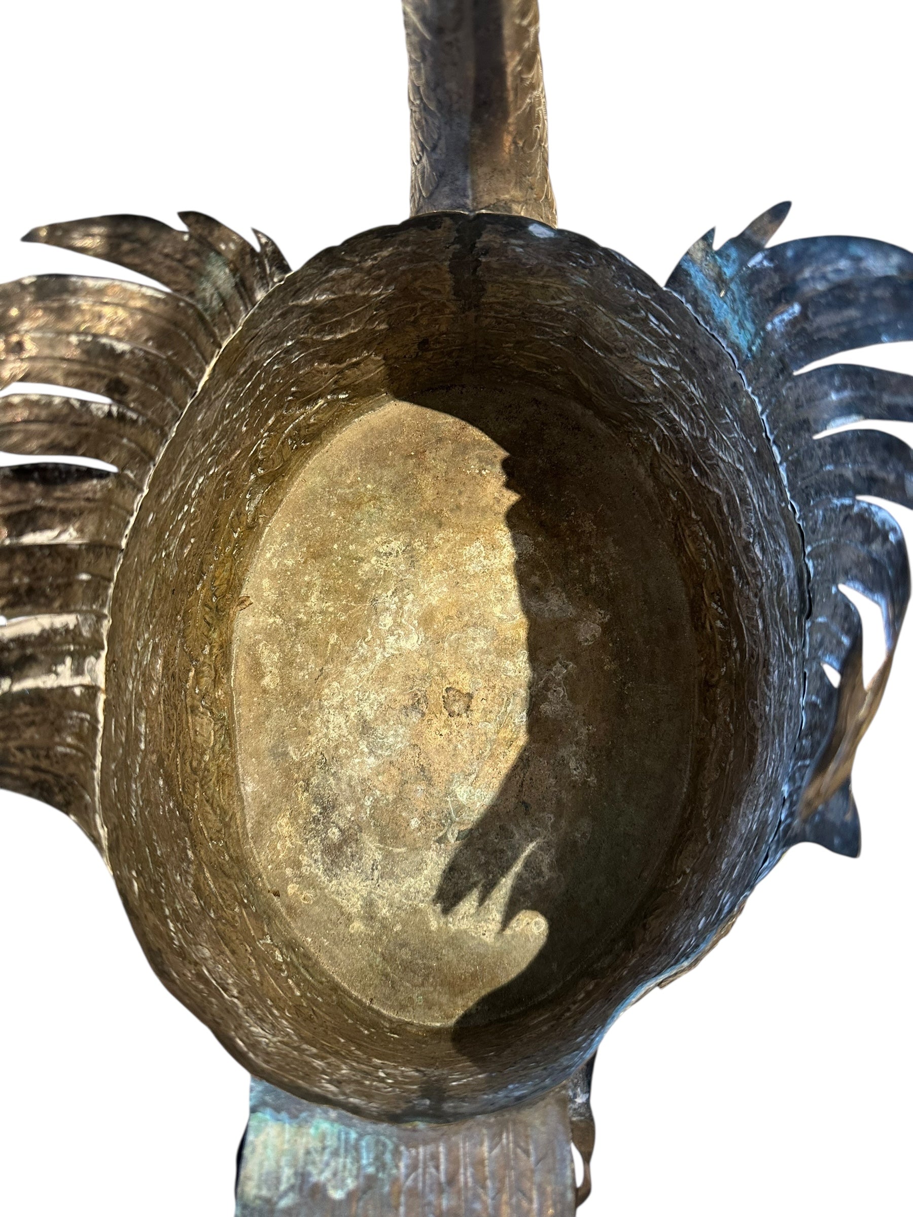Close-up of the silver-plated swan jardiniere's hollow interior planter cavity with aged patina