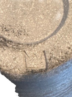 Close-up of the vase's base showing an incised maker's mark