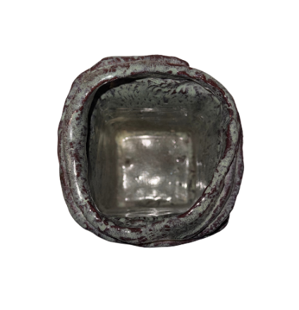 Vintage rectangular ceramic vase with a dark greenish-gray and burgundy glaze, textured crosshatched surface, and raised ceramic bands wrapping around the body. Features an irregular square opening, glossy interior, and unglazed reddish-brown base with an incised maker's mark