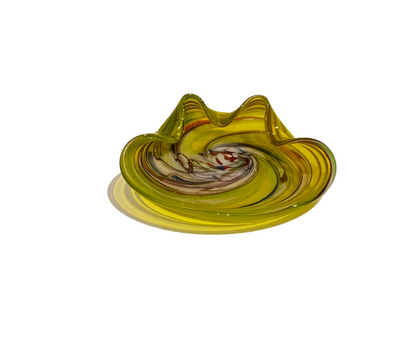 Vintage translucent yellow art glass bowl with a sculptural folded rim and multicolored spiral design featuring white, amber, red, blue, and brown swirls.