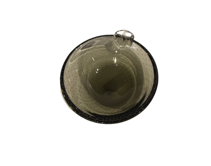 Vintage smoky gray-green glass ashtray with a rounded bowl, evenly spaced controlled bubbles, dark glass rim, and a single clear sculptural cigarette rest.
