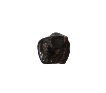 Top View of Dark cast iron statue depicting Napoleon Bonaparte standing with his arms crossed, wearing a bicorne military hat, long overcoat, and boots. The figure stands on a stepped rectangular black marble base.