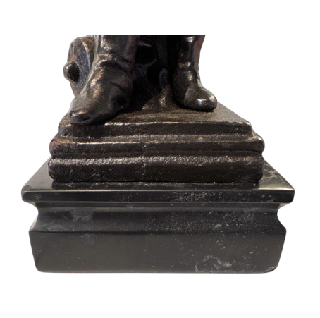 Close up Front view of Statues feet and marble base