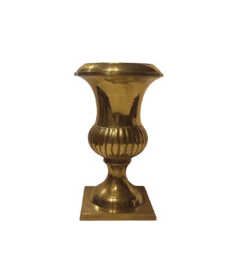 Full front view of a Neoclassical-style brass urn with a flared circular rim, smooth tapered neck, ribbed lower body, and turned pedestal resting on a square brass base. The polished gold-tone finish reflects light and displays minor surface wear.