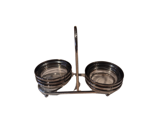 Angled view of six vintage round glass coasters with platinum-tone fade rims, stacked in a two-sided metal carrying caddy.