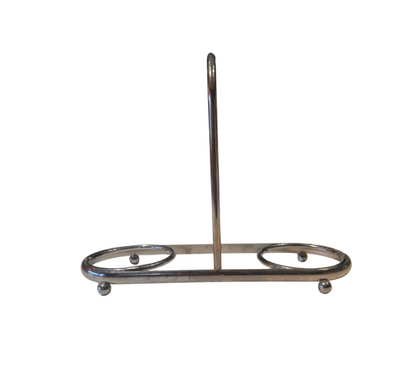Empty vintage silver-tone metal coaster holder featuring two circular compartments, a central loop handle, and four small ball feet.