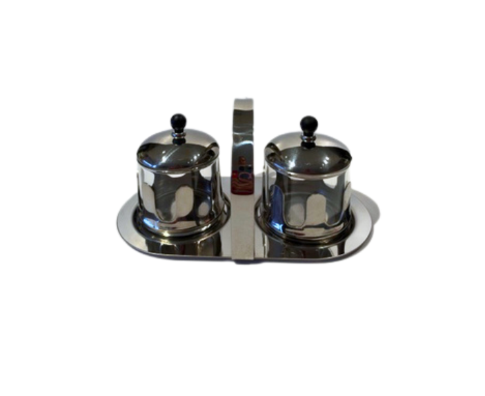 Vintage Michael Graves cream and sugar set featuring two glass containers in chrome holders with black lids on a matching oval caddy.