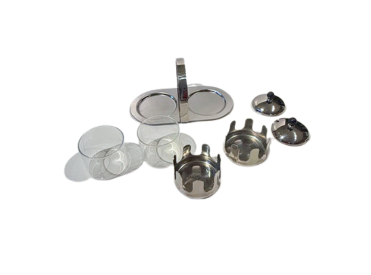 Close-up of the individual glass, chrome, and black resin components of the vintage serving set.