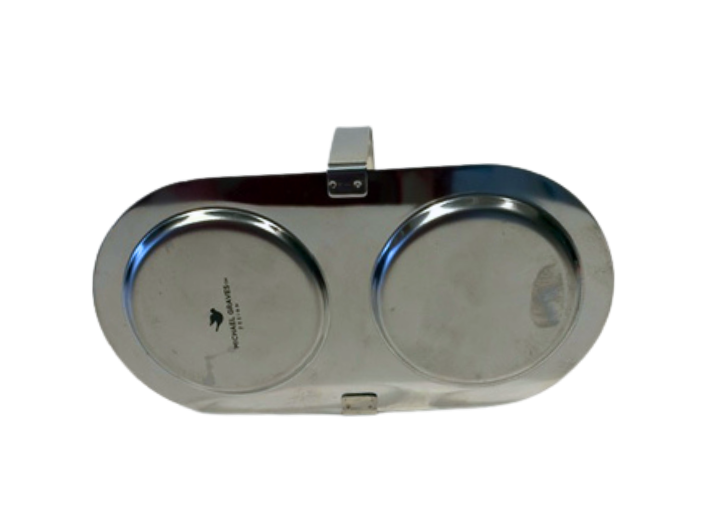 Underside of the oval Michael Graves chrome caddy showing its base and construction.