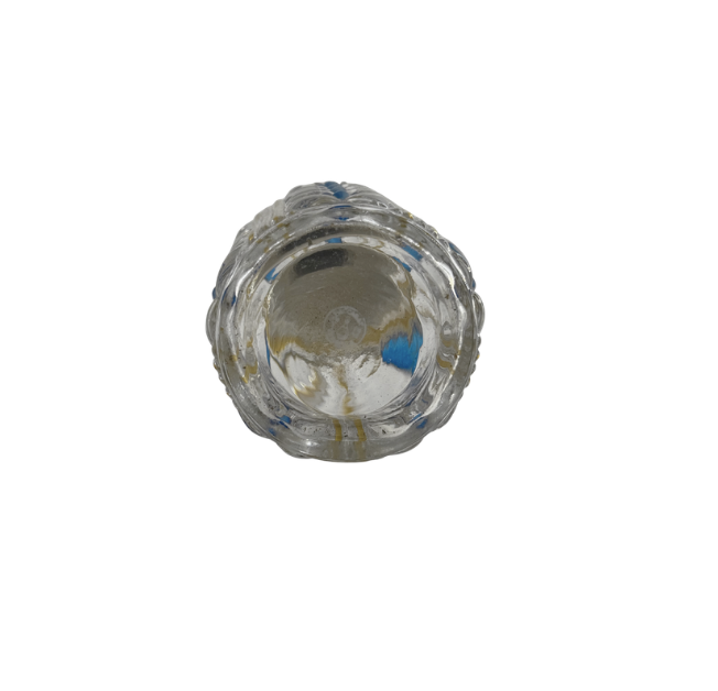 Top view into the antique Baccarat perfume bottle opening, showing scalloped crystal rim and blue-gold accents