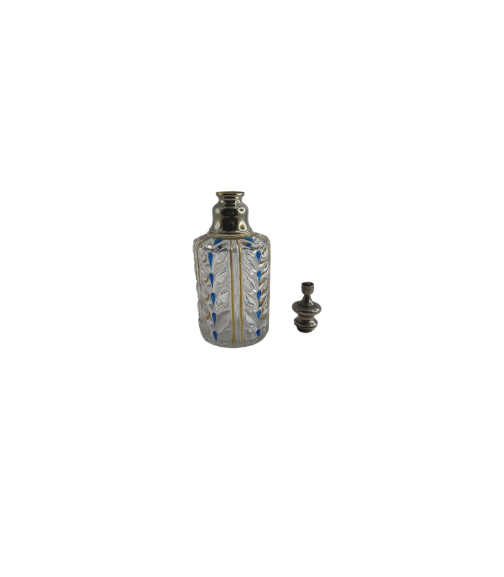 Antique Baccarat perfume bottle shown with its faceted crystal stopper resting beside it