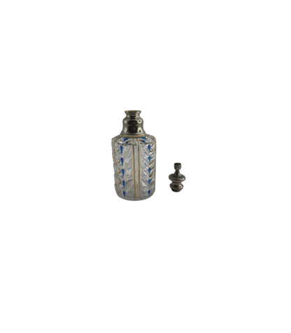 Antique Baccarat perfume bottle shown with its faceted crystal stopper resting beside it