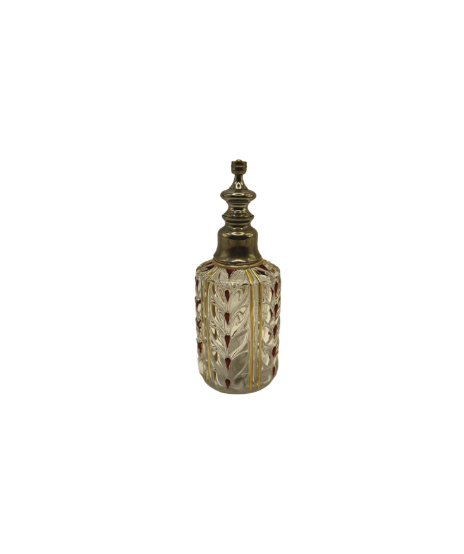 Antique Baccarat cut-crystal perfume bottle with red-and-gilt foliate accents and metal stopper, front view