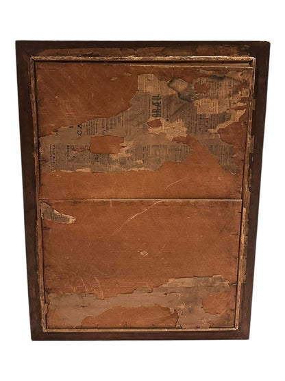 Back of the antique Mary painting's wood frame, showing aged backing board with old newspaper fragments